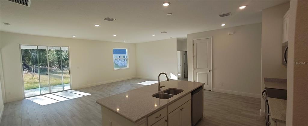 75 Kankakee Trail Palm Coast, FL 32164 - Photo 5 of 11 a kitchen with a sink and a refrigerator