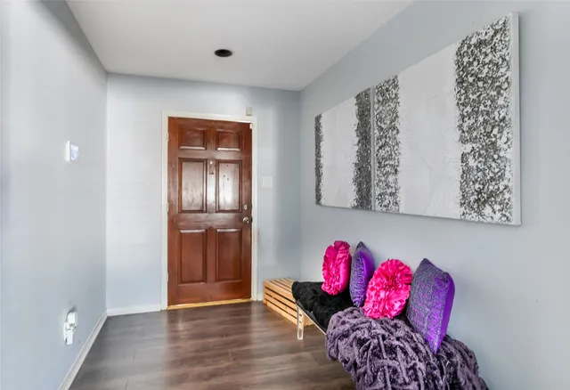 a view of a livingroom with furniture and wooden floor