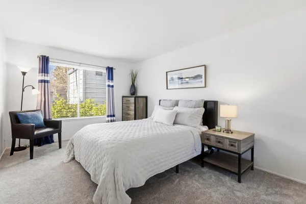 a bedroom with a bed and a couch