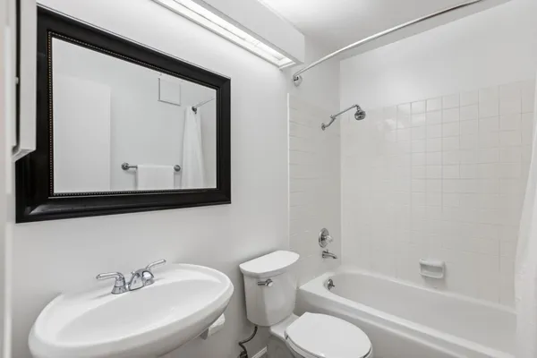 a bathroom with a toilet sink and bathtub