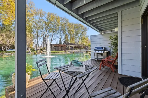 a view of a chairs and table in the patio