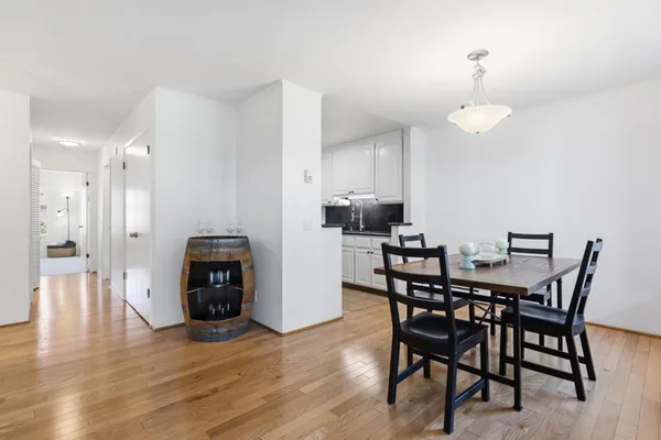 a view of a dining room with furniture and wooden floor