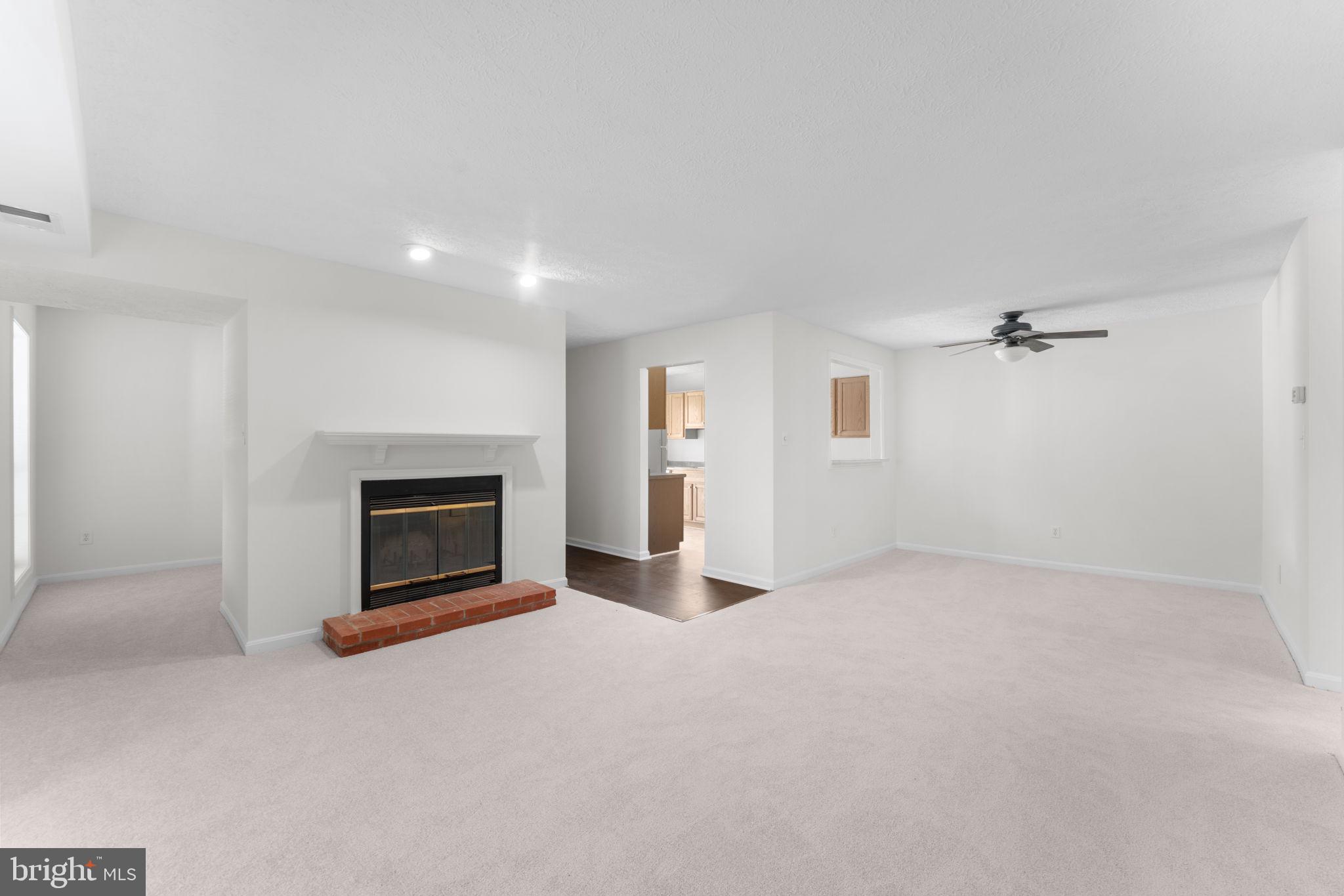 10013 Oakton Terrace Road Oakton, VA 22124 - Photo 15 of 52 Living room with cozy fireplace