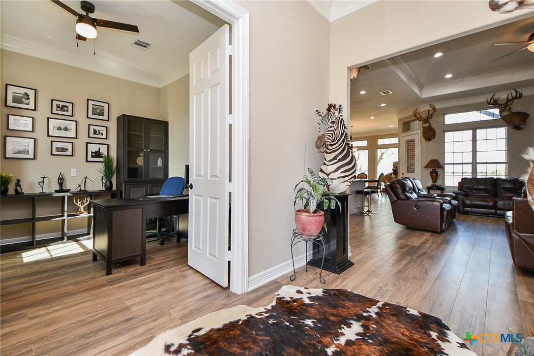 1093 Sunderman Road Alleyton, TX 78935 - Photo 17 of 48 a living room with furniture and a wooden floor