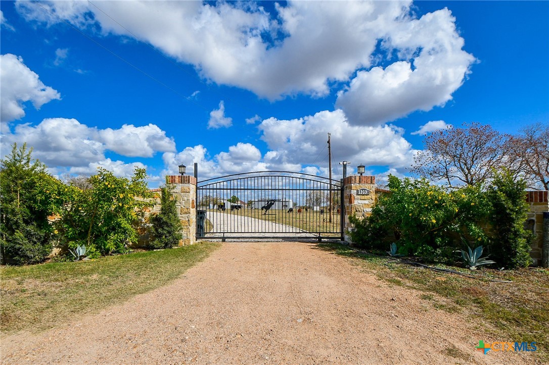 1093 Sunderman Road Alleyton, TX 78935 - Photo 2 of 48 a view of a house with a yard