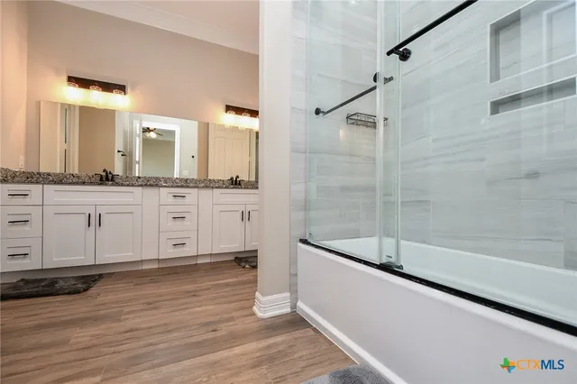 a bathroom with a bathtub and a sink