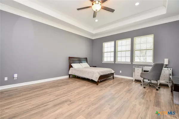 a bedroom with a bed and a desk