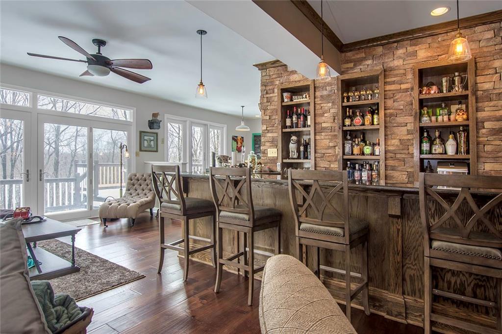 149 Backbone Road Sewickley, PA 15143 - Photo 12 of 25 The Bar Has a Gorgeous Stone Wall, Built-In Storage and Lovely Pendant Lighting. The Ideal Gathering Spot!