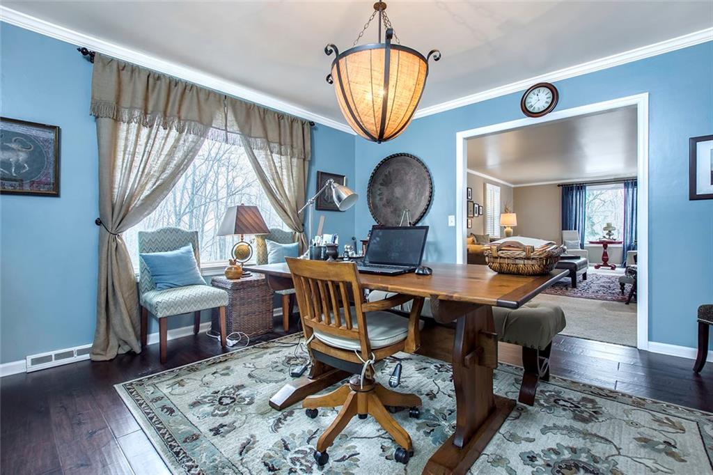 149 Backbone Road Sewickley, PA 15143 - Photo 5 of 25 Dining Room with Hardwood Flooring, Crown Molding and a Lovely Chandelier.