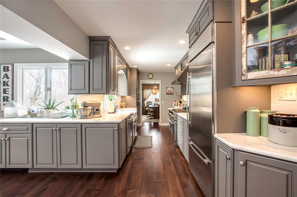 149 Backbone Road Sewickley, PA 15143 - Photo 8 of 25 Carrera Marble Counter Tops and All Jenn-Air Stainless Appliances Complete the Look