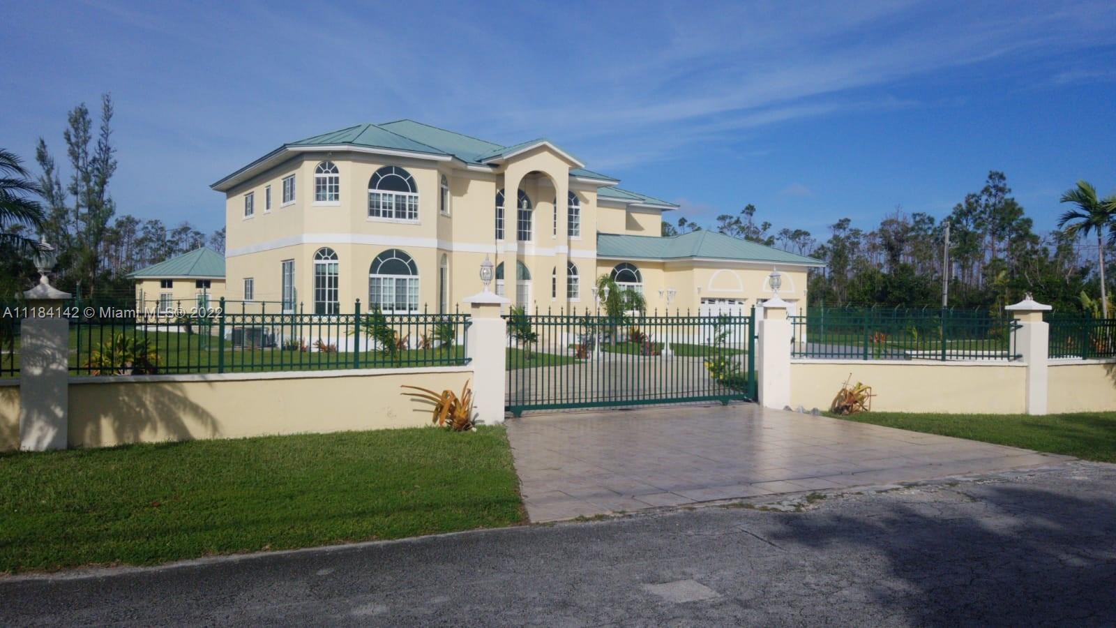 a front view of a house with a yard table and seating