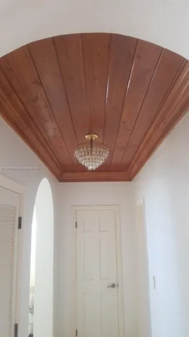 a view of a house with a yard from a tub