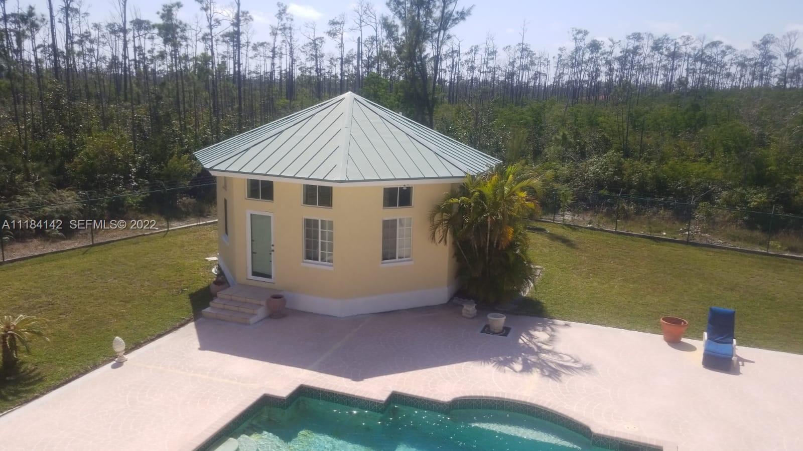 6 Bahama undefined, BA 00000 - Photo 12 of 15 a view of a house with a yard from a tub