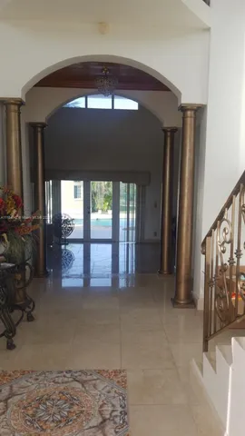 a kitchen with stainless steel appliances granite countertop a refrigerator and a stove