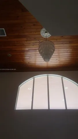 a view of a room with a large window