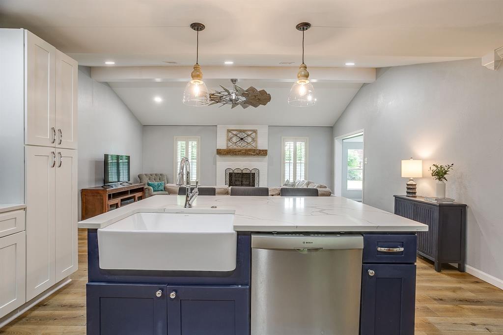 408 Jeri Ridge Road Willow Park, TX 76087 - Photo 15 of 38 Kitchen island with a farmhouse sink, stainless steel dishwasher, and pendant lighting