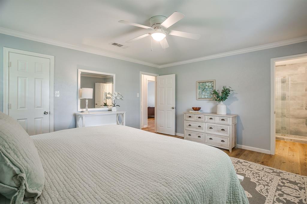408 Jeri Ridge Road Willow Park, TX 76087 - Photo 21 of 38 Interior room featuring wood-finish flooring, light blue walls, and white crown molding