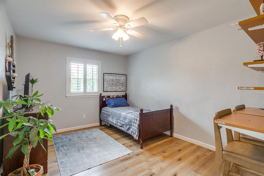 408 Jeri Ridge Road Willow Park, TX 76087 - Photo 27 of 38 Room with wood-finish flooring, a ceiling fan, and white window shutters