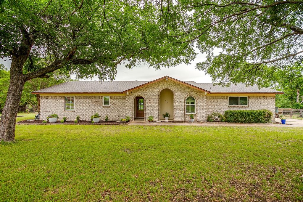 408 Jeri Ridge Road Willow Park, TX 76087 - Photo 29 of 38 Brick exterior with an arched entry and wood-finish door