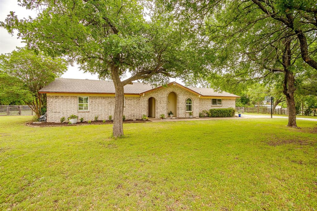 408 Jeri Ridge Road Willow Park, TX 76087 - Photo 30 of 38 Light-colored brick exterior with arched entryway and window details