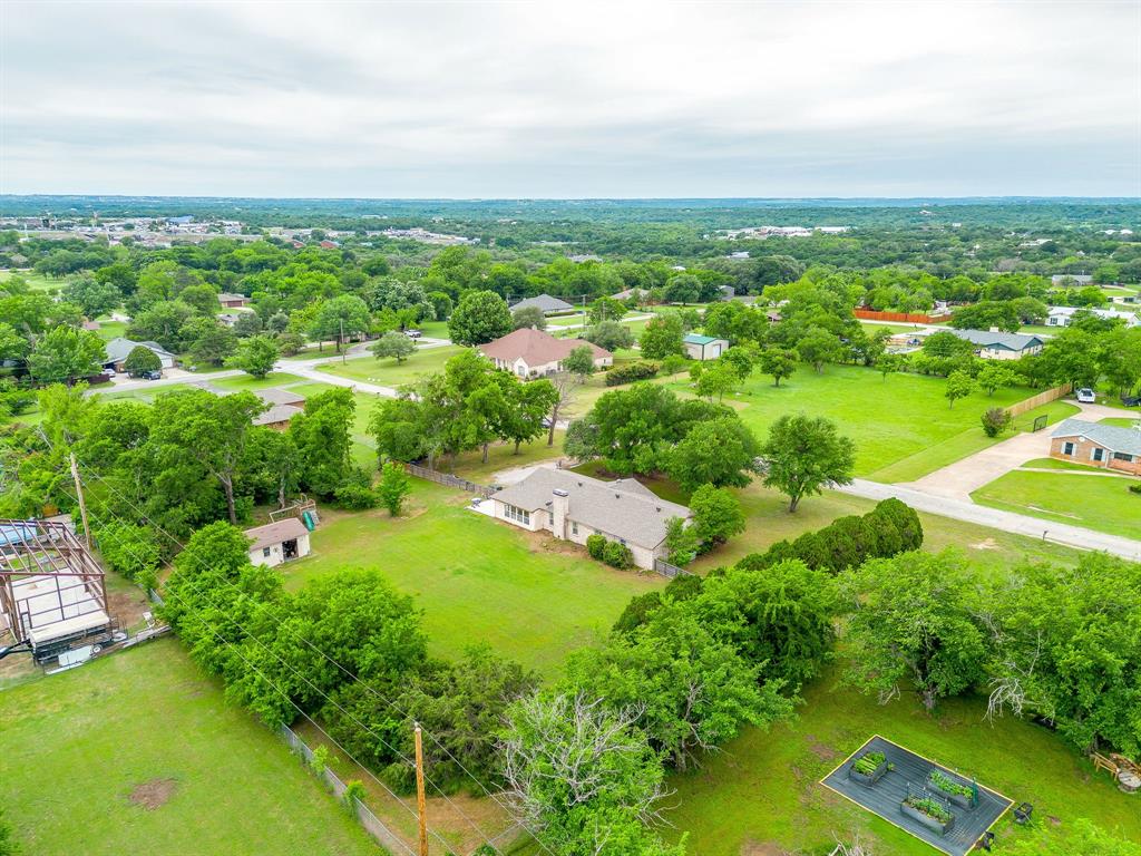 408 Jeri Ridge Road Willow Park, TX 76087 - Photo 37 of 38 Expansive property featuring a single-story residence, mature trees, and a detached shed