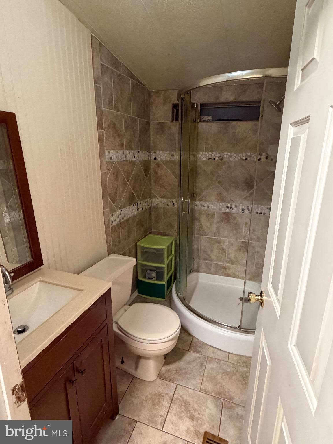 1807 Sandee Court Edgewood, MD 21040 - Photo 12 of 20 a white toilet sitting next to a bath tub