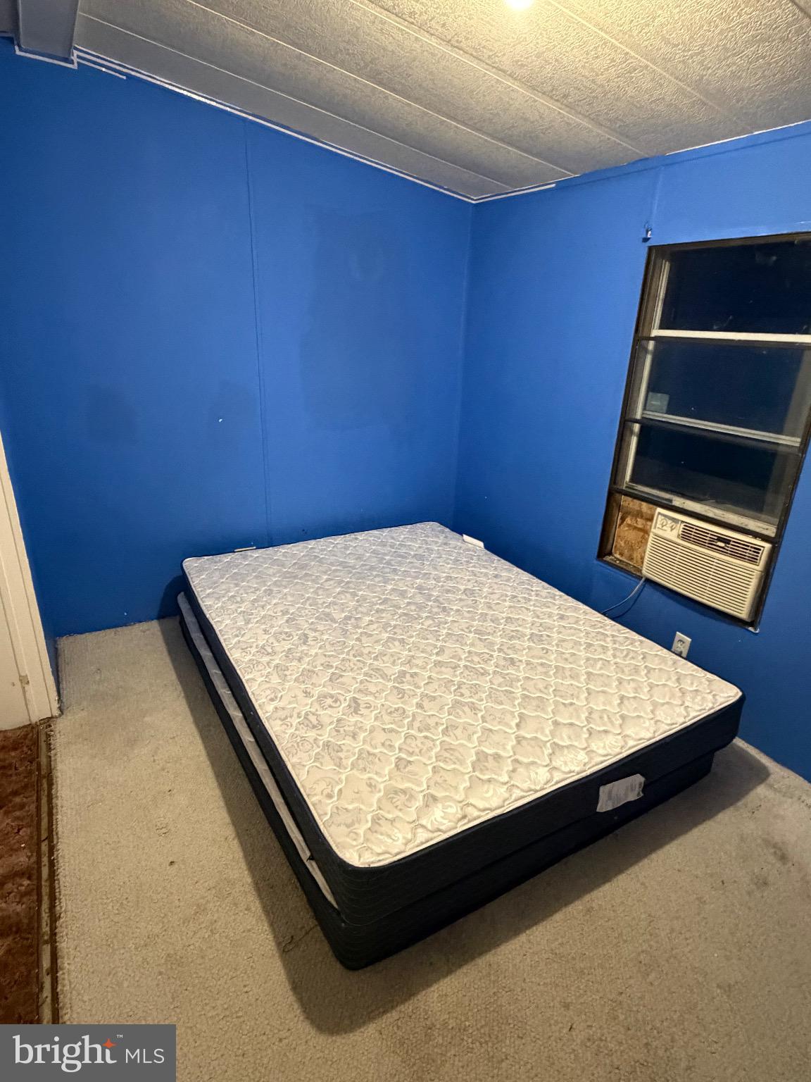 1807 Sandee Court Edgewood, MD 21040 - Photo 12 of 19 Cozy blue-walled room with a mattress.