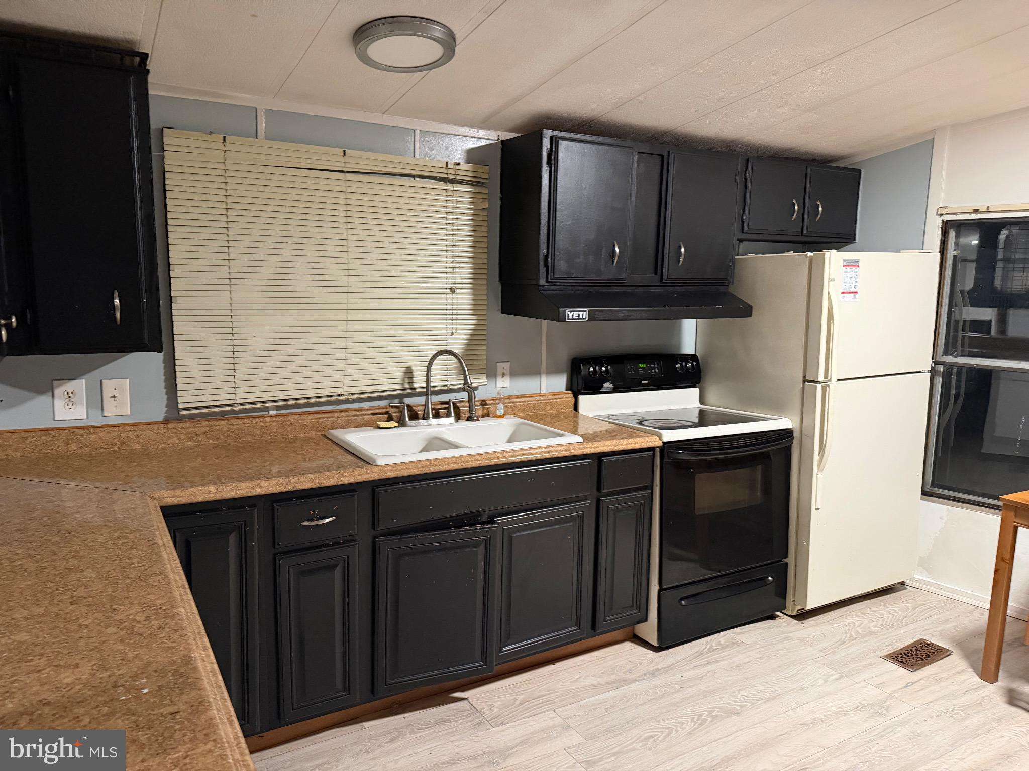 1807 Sandee Court Edgewood, MD 21040 - Photo 18 of 19 Modern kitchen with sleek black cabinetry.