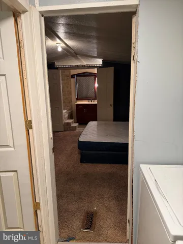 a en suite bathroom with a sink and a mirror