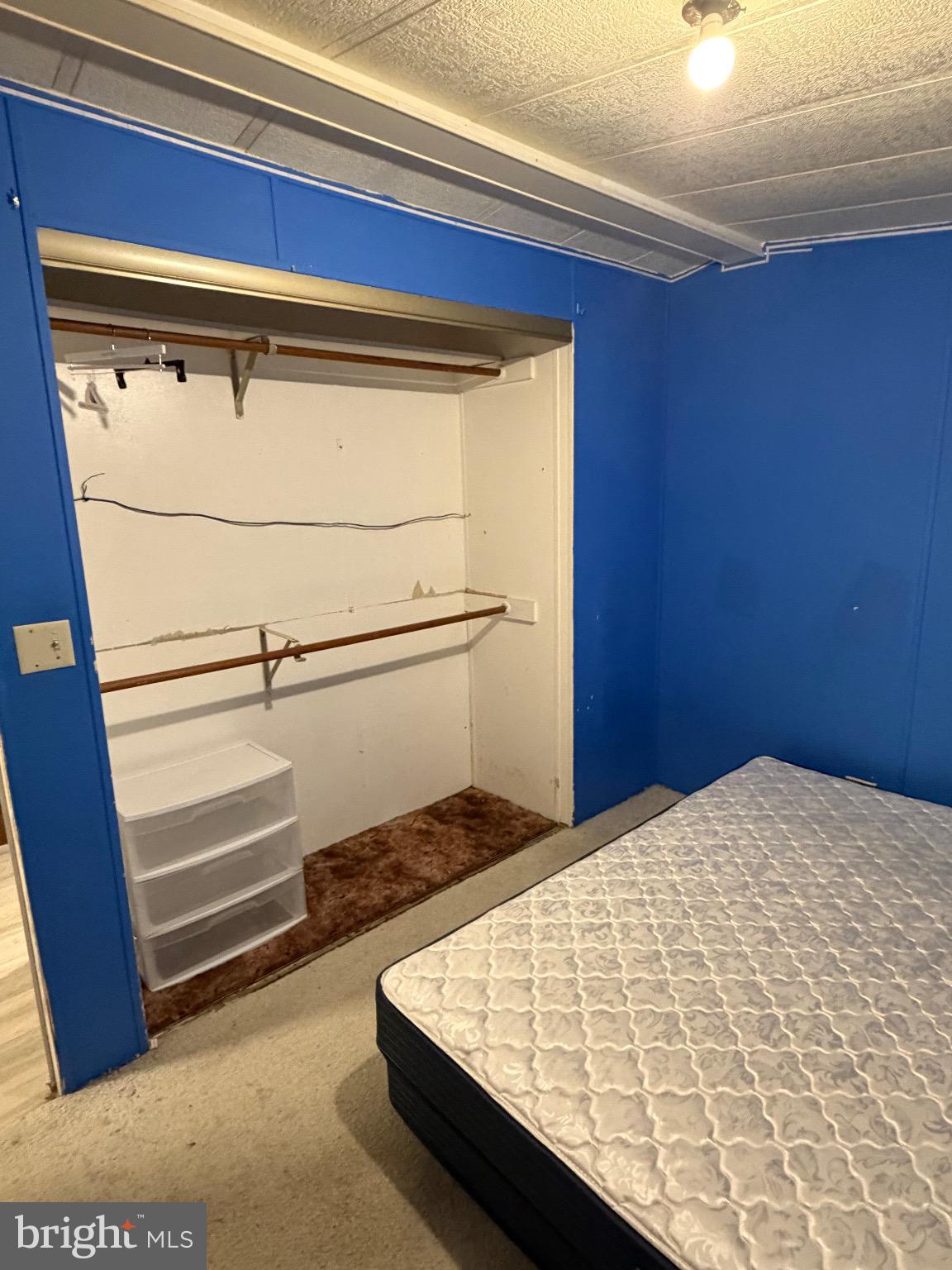 1807 Sandee Court Edgewood, MD 21040 - Photo 10 of 20 a bed sitting in a bedroom next to a window