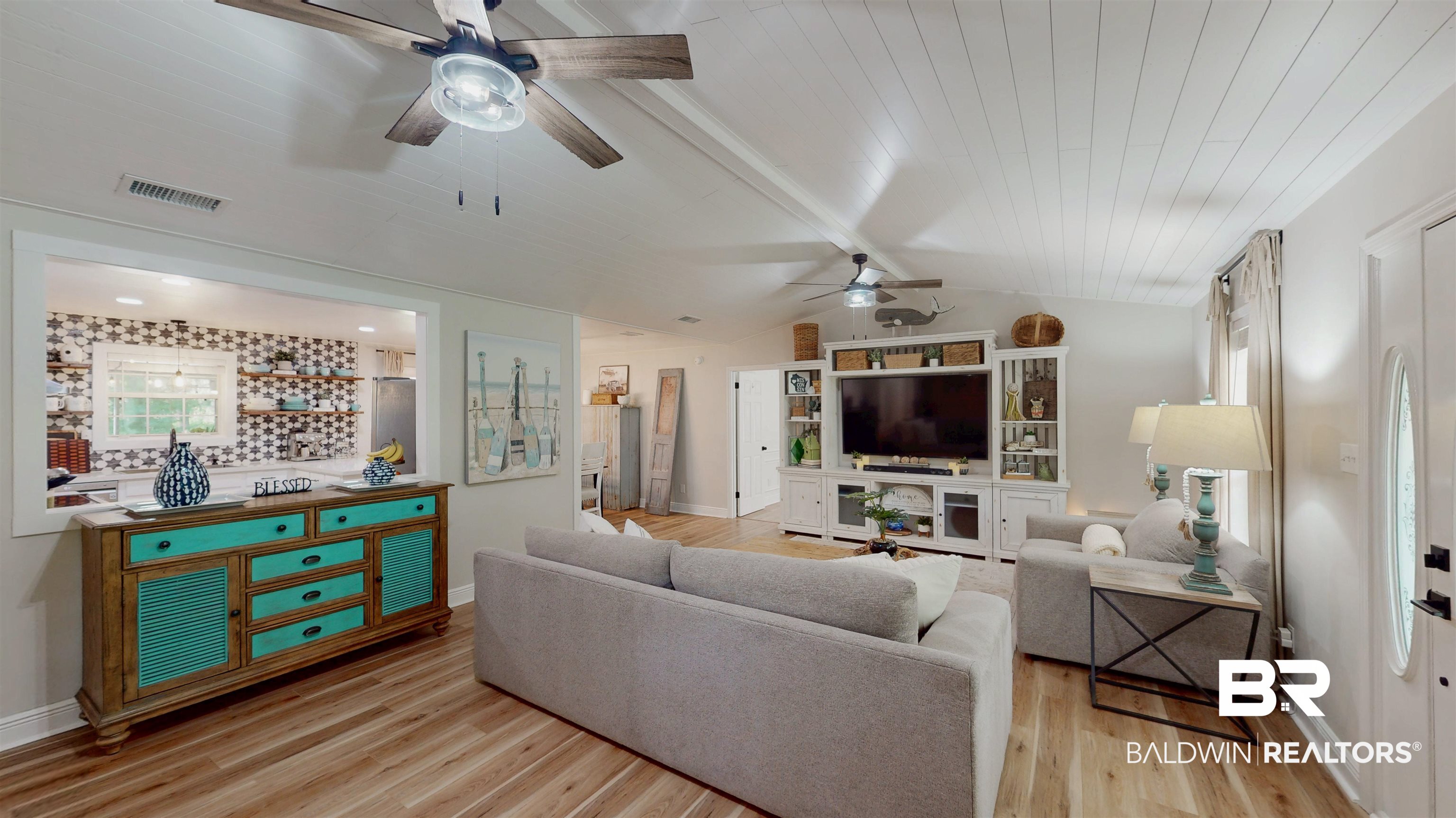9902 Clarke Ridge Road Foley, AL 36535 - Photo 10 of 61 Living room featuring baseboards, a ceiling fan, visible vents, and light wood-style floors