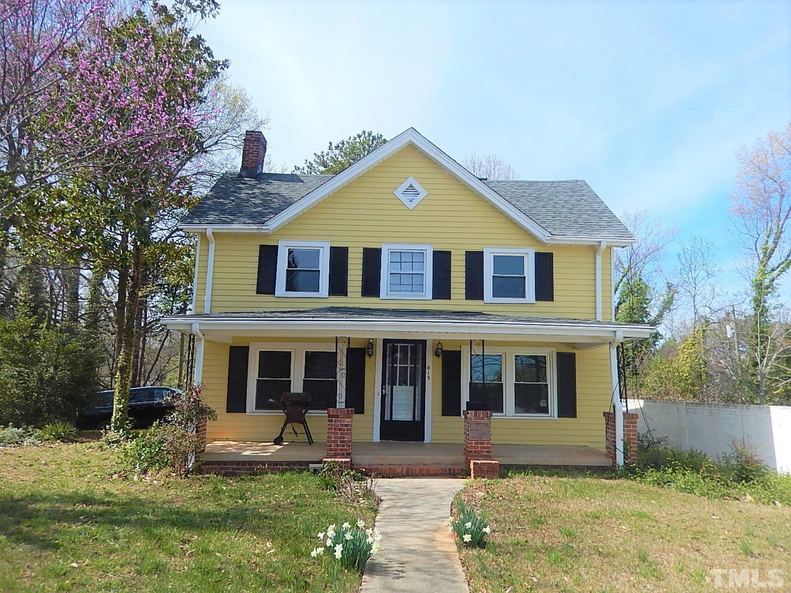 1015 Oberlin Road Raleigh, NC 27607 - Photo 1 of 26 a front view of a house with garden