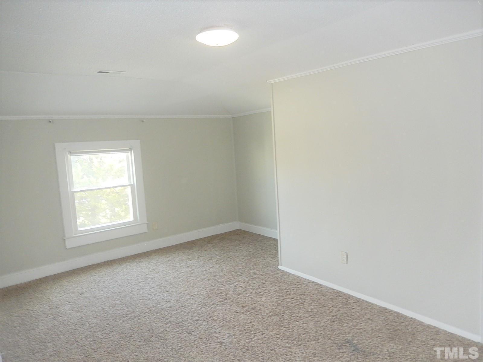 1015 Oberlin Road Raleigh, NC 27607 - Photo 13 of 26 an empty room with a window