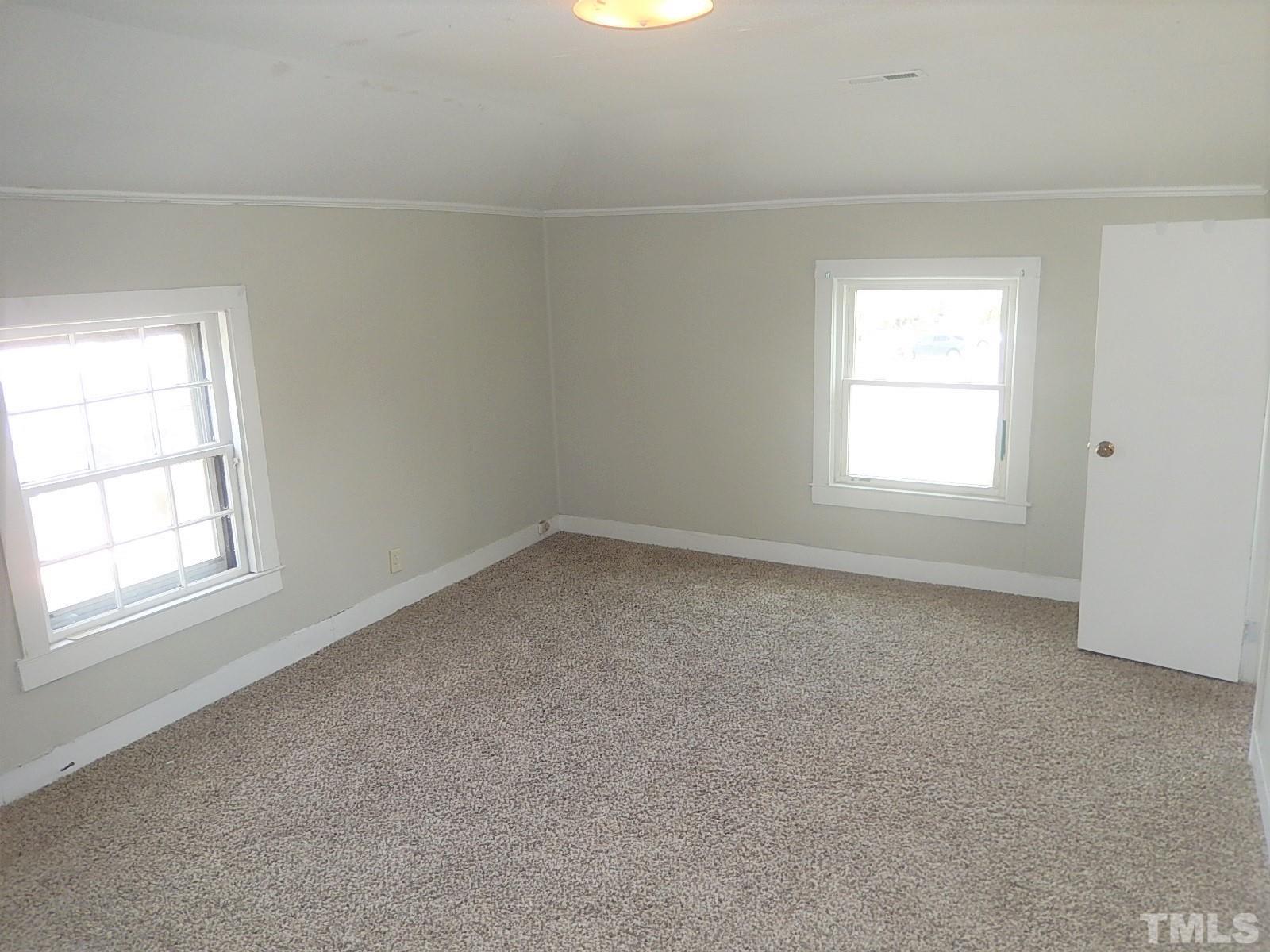 1015 Oberlin Road Raleigh, NC 27607 - Photo 14 of 26 an empty room with a window