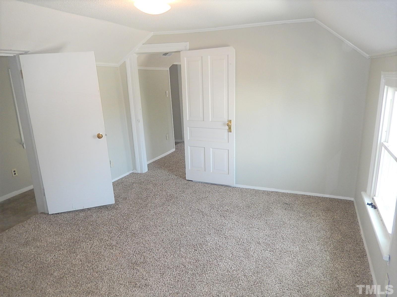 1015 Oberlin Road Raleigh, NC 27607 - Photo 15 of 26 a view of an empty room and a window
