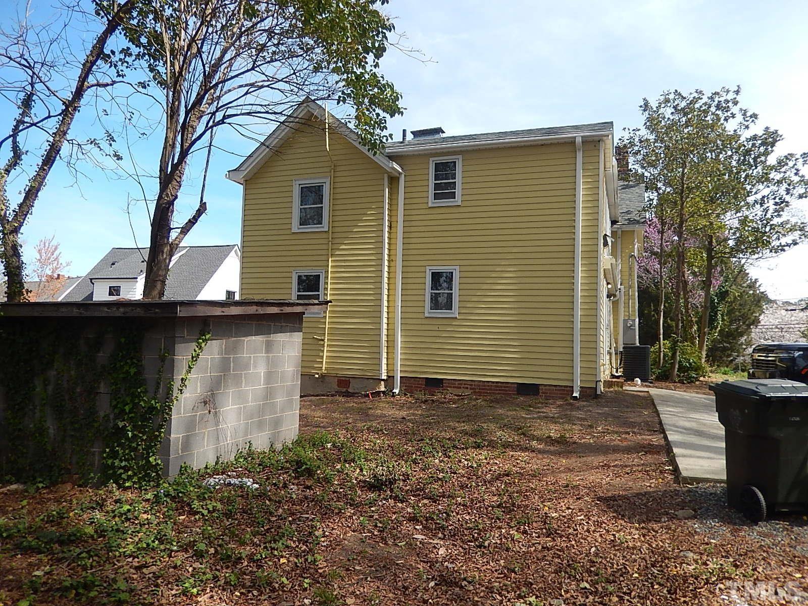 1015 Oberlin Road Raleigh, NC 27607 - Photo 21 of 26 a front view of a house with a yard