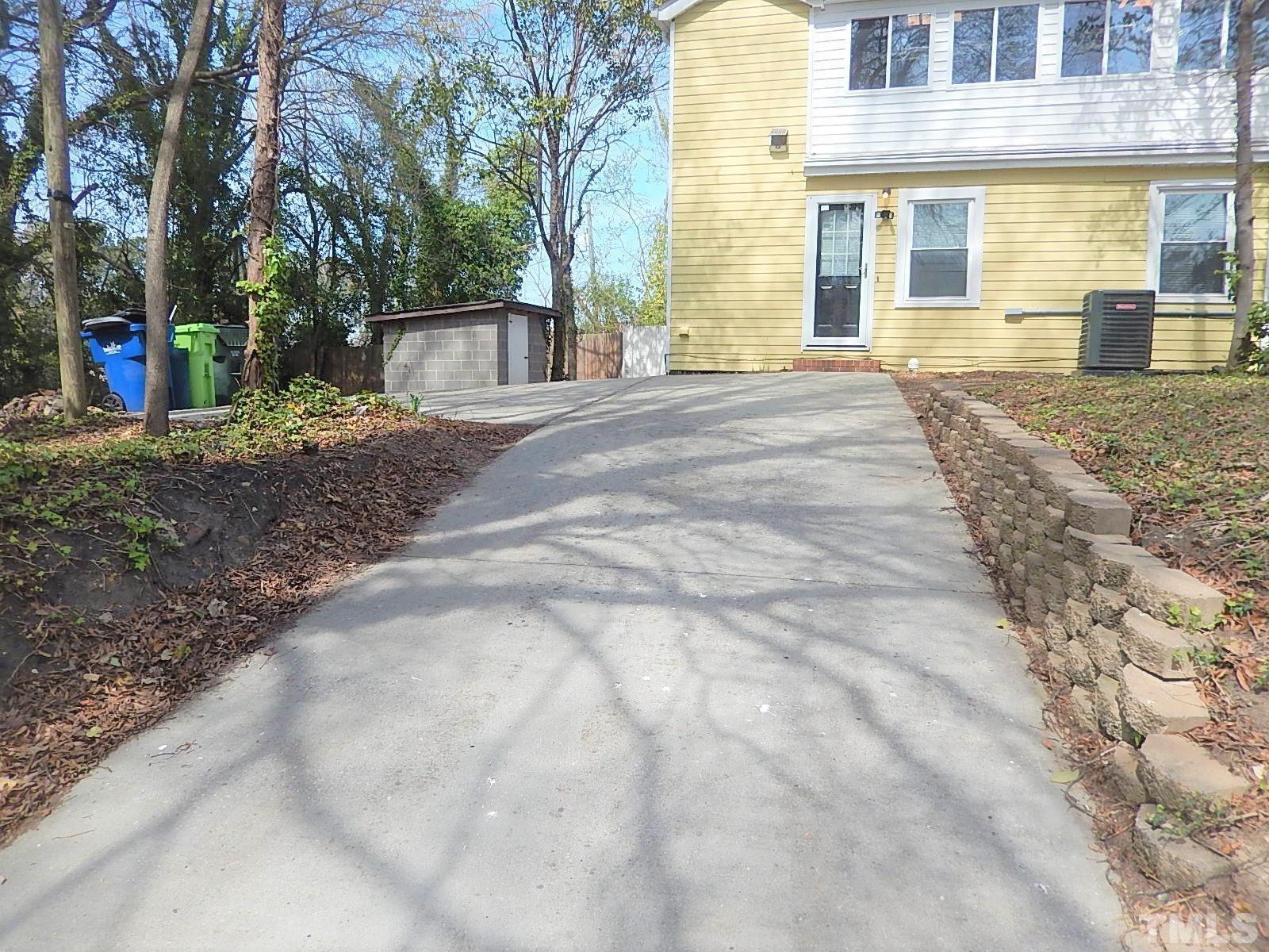 1015 Oberlin Road Raleigh, NC 27607 - Photo 23 of 26 a view of a house with backyard and trees