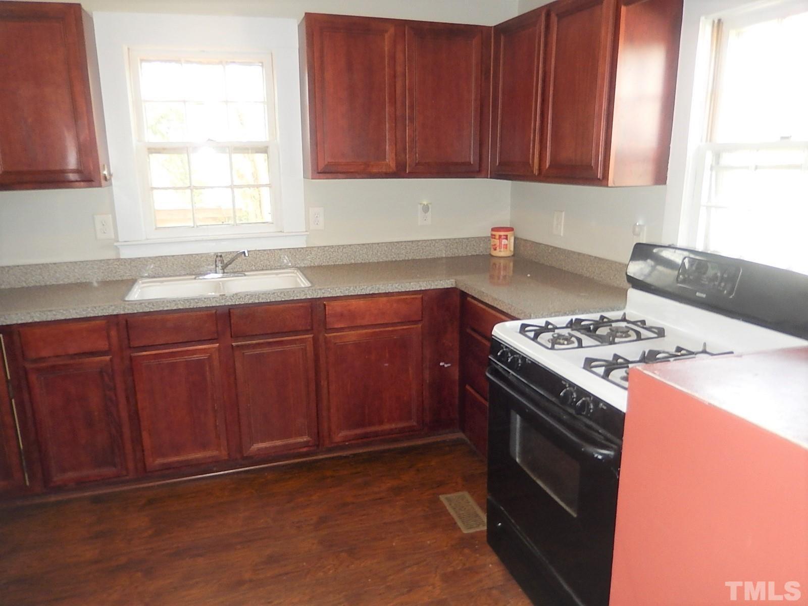 1015 Oberlin Road Raleigh, NC 27607 - Photo 6 of 26 a kitchen with a stove and a sink