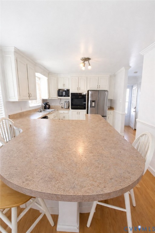 10 Rhodes Lane Cartersville, VA 23027 - Photo 13 of 16 Kitchen with light wood finished floors, light cou