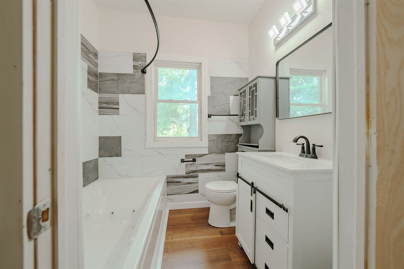 804 North Walnut Street Pontiac, IL 61764 - Photo 15 of 38 a bathroom with a sink a toilet and a mirror