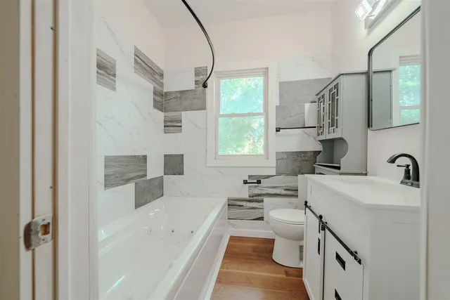 a kitchen with a sink a stove a refrigerator and a window