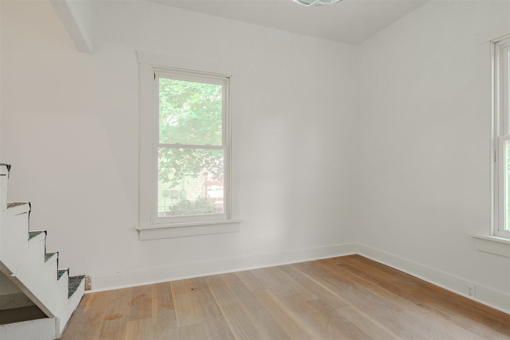 804 North Walnut Street Pontiac, IL 61764 - Photo 17 of 38 an empty room with a window