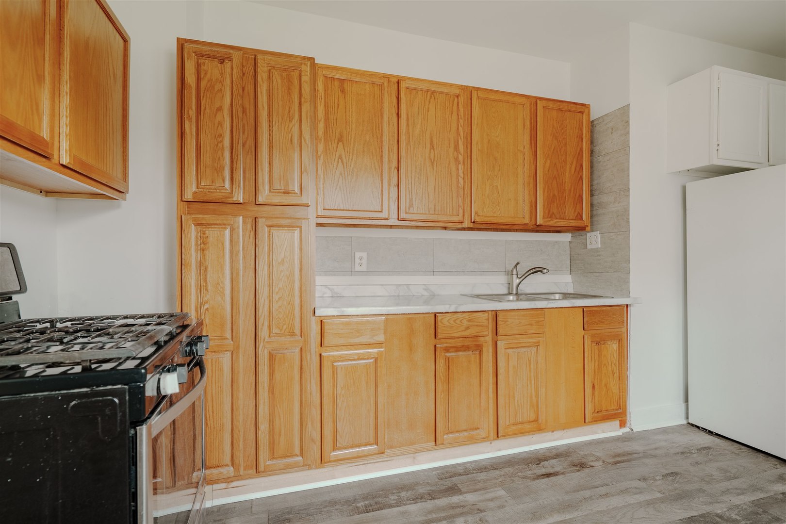 804 North Walnut Street Pontiac, IL 61764 - Photo 26 of 38 a view of a kitchen with wooden floor and cabinets