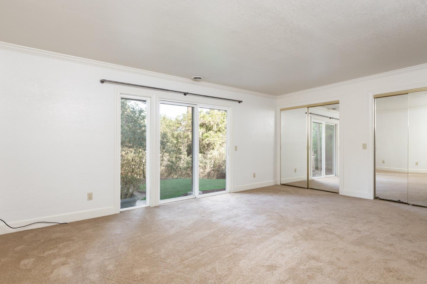 4095 Crest Road Pebble Beach, CA 93953 - Photo 11 of 21 a view of an empty room with a window