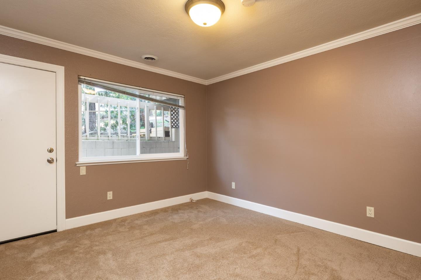 4095 Crest Road Pebble Beach, CA 93953 - Photo 14 of 21 a view of an empty room with a window