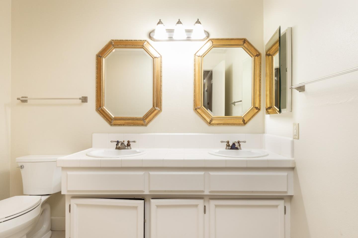 4095 Crest Road Pebble Beach, CA 93953 - Photo 16 of 21 a bathroom with a sink vanity and a mirror