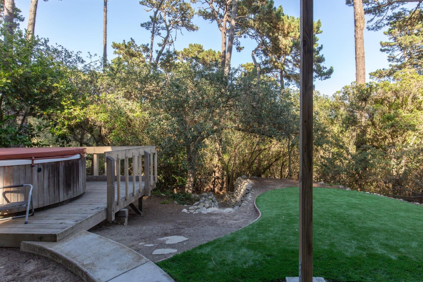 4095 Crest Road Pebble Beach, CA 93953 - Photo 17 of 21 a view of a deck with backyard and trees