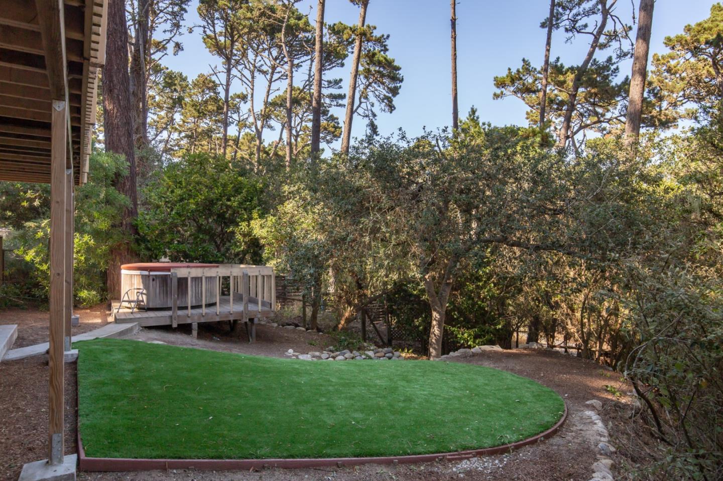 4095 Crest Road Pebble Beach, CA 93953 - Photo 19 of 21 a view of a house with backyard sitting area and garden