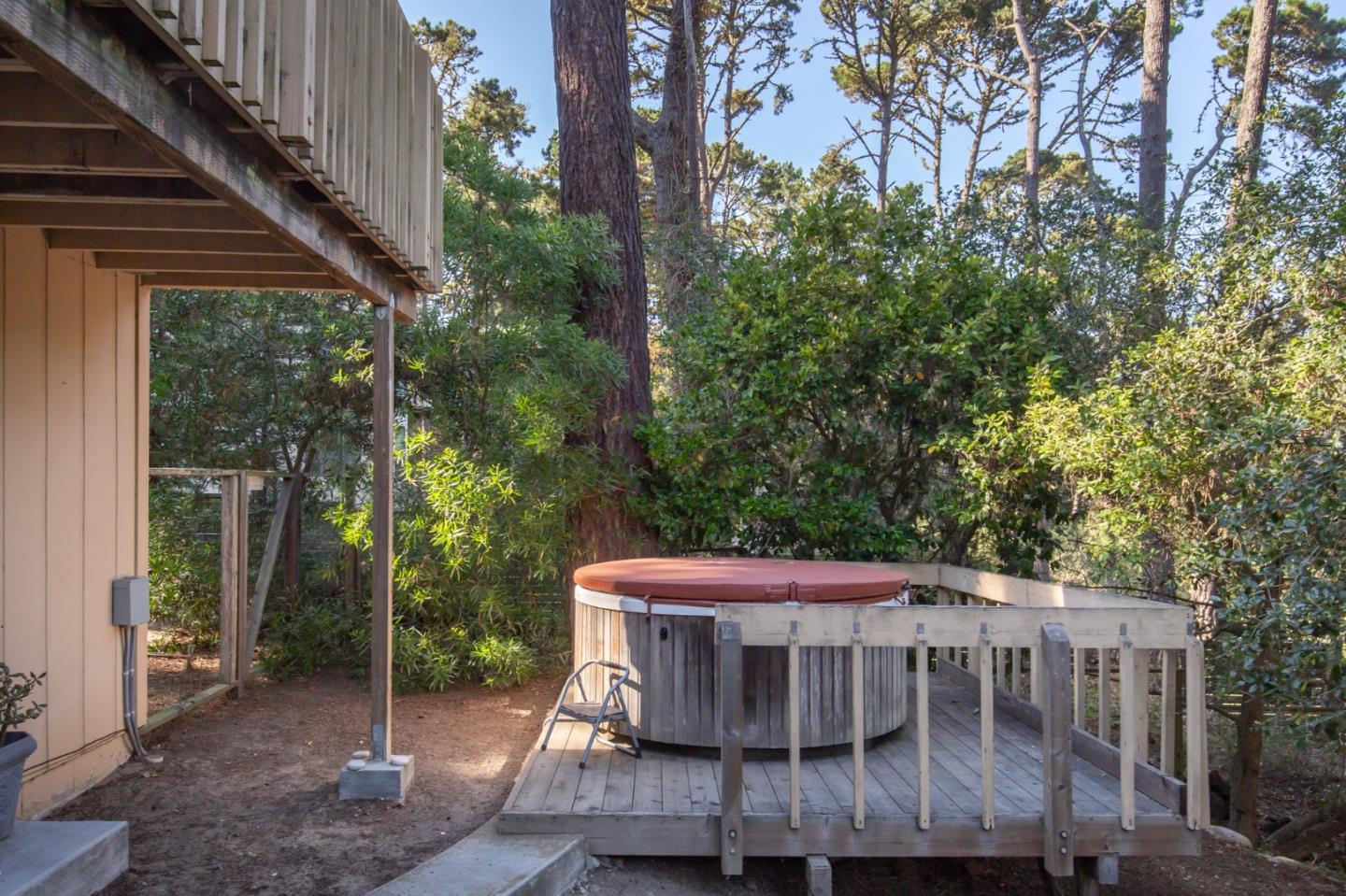 4095 Crest Road Pebble Beach, CA 93953 - Photo 20 of 21 a wooden bench sitting in front of a building