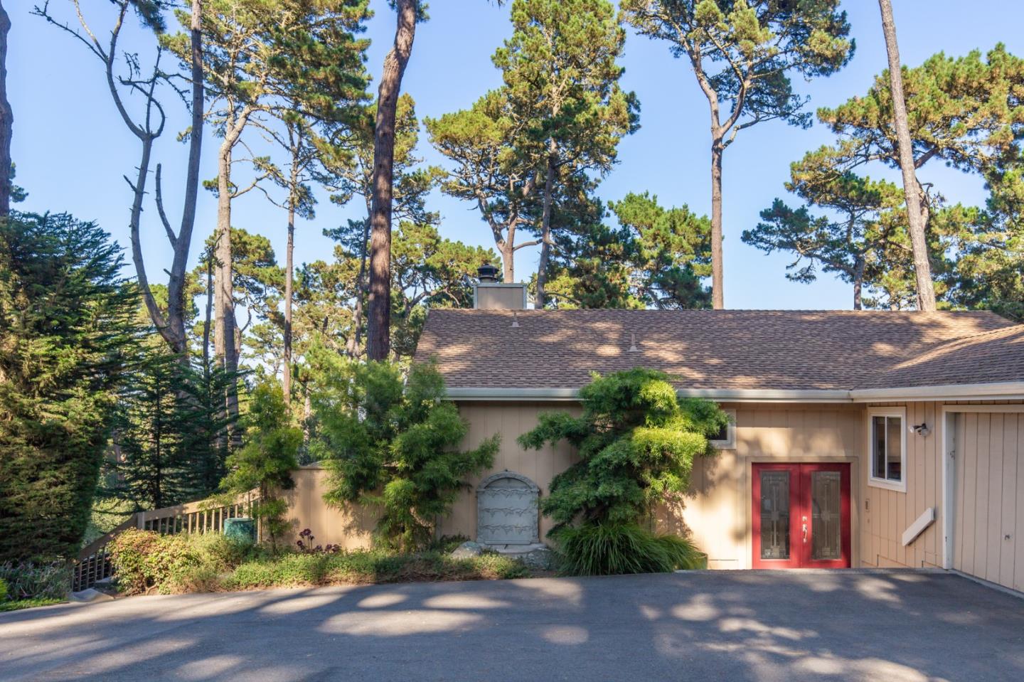 4095 Crest Road Pebble Beach, CA 93953 - Photo 3 of 21 a front view of a house with garden